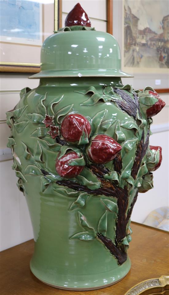 A pair of Chinese green ground jars and covers